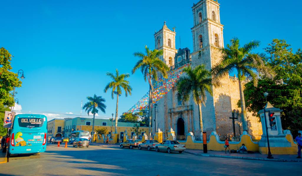 Unidentified people walking at outdoors of Church of San Servacio Saint Servatius in Valladolid, Yucatan,